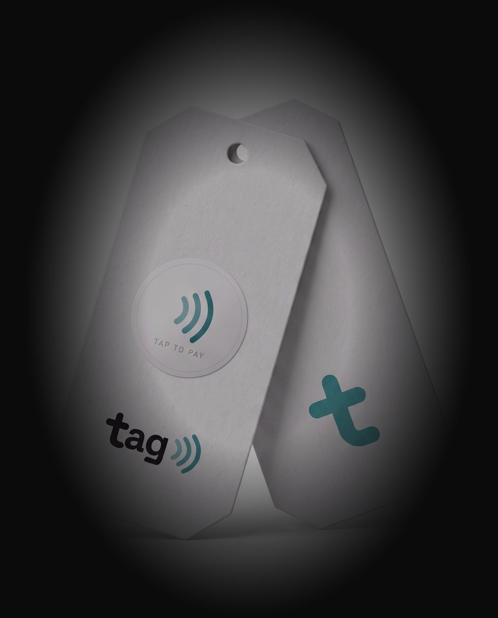 TAG sticker on a standard paper hang tag — and the t mark on the back